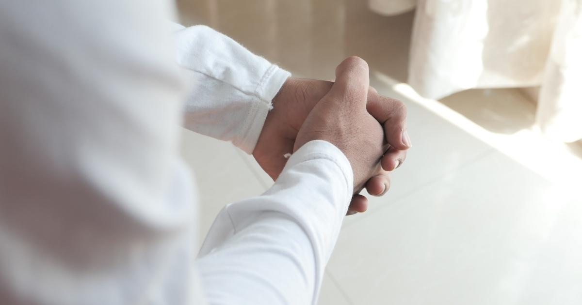 worried person wringing hands