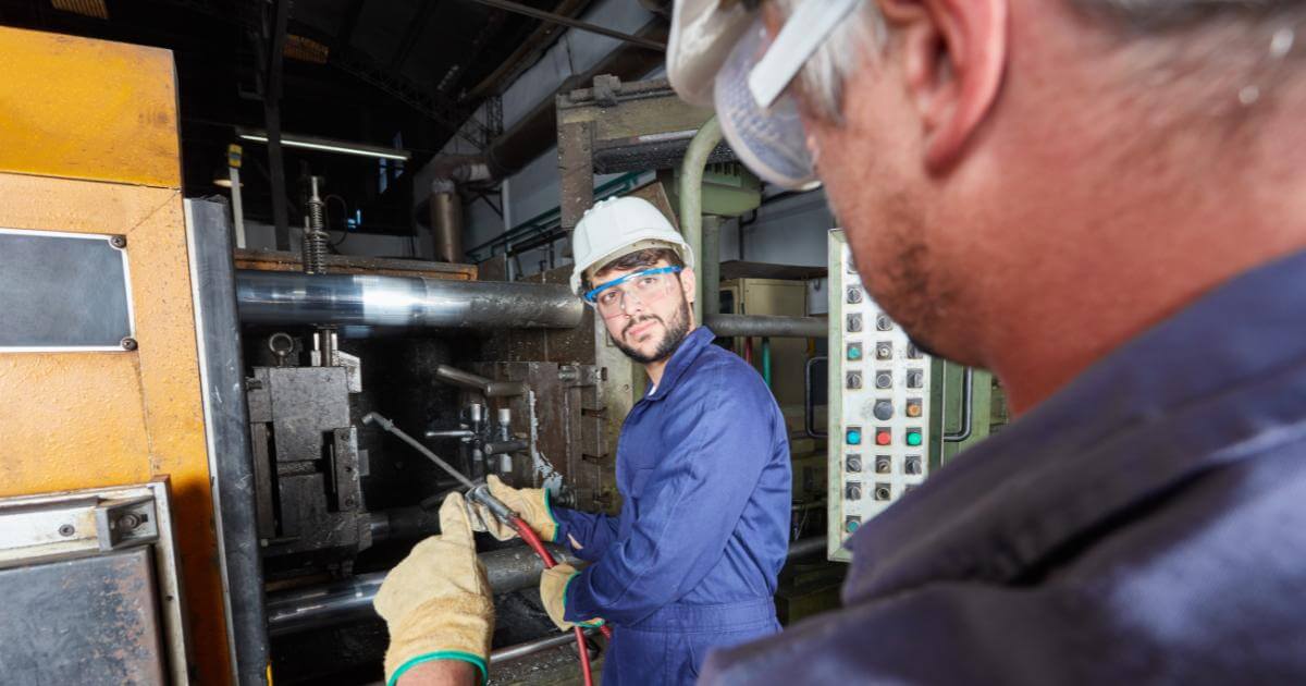 manufacturer worker with his mentor