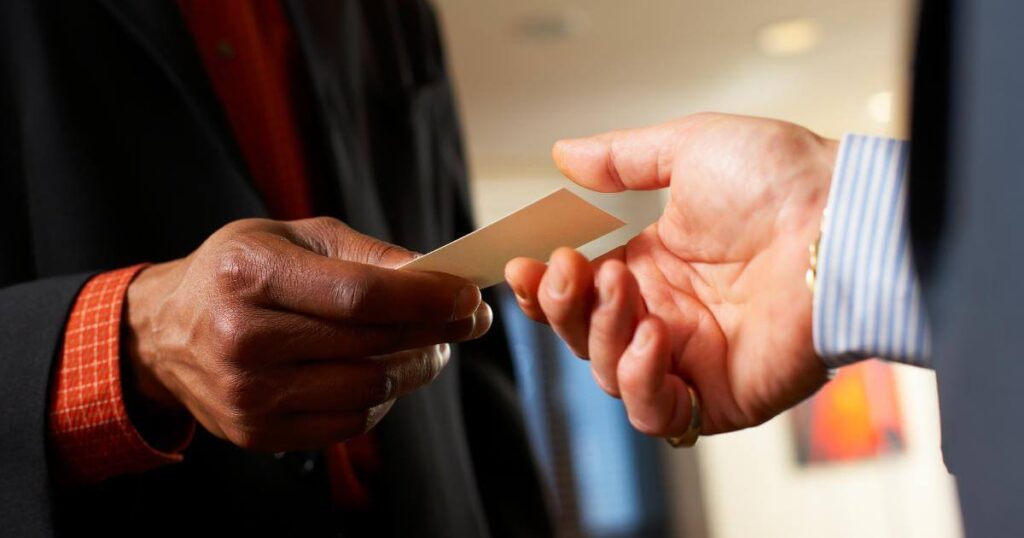 business men exchanging business cards