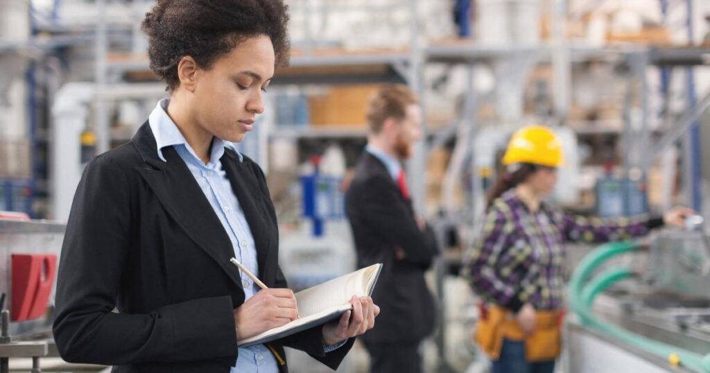 taking notes during manufacturing quality inspection